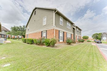 Two story apartment building with brick foundation